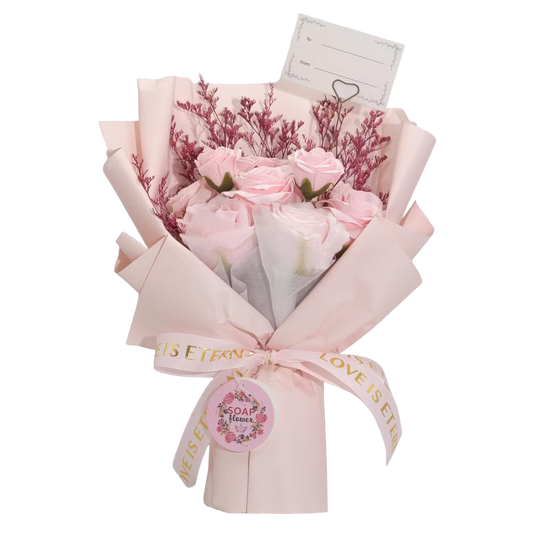 Pink Roses Bouquet featuring delicate soap petals in soft pink wrapped in matching pink paper with satin ribbon and decorative foliage