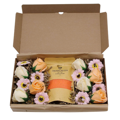 Salt Soak Set - Total Detox in an open kraft gift box with yellow soak packaging and pink, peach, and white flowers