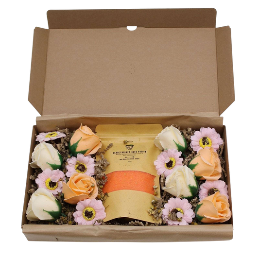 Salt Soak Set - Total Detox in an open kraft gift box with yellow soak packaging and pink, peach, and white flowers
