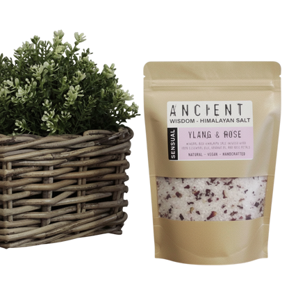 Sensual Himalayan Bath Salt pouch with pink and white salt crystals, dried rose petals, and Ylang Ylang rose blend