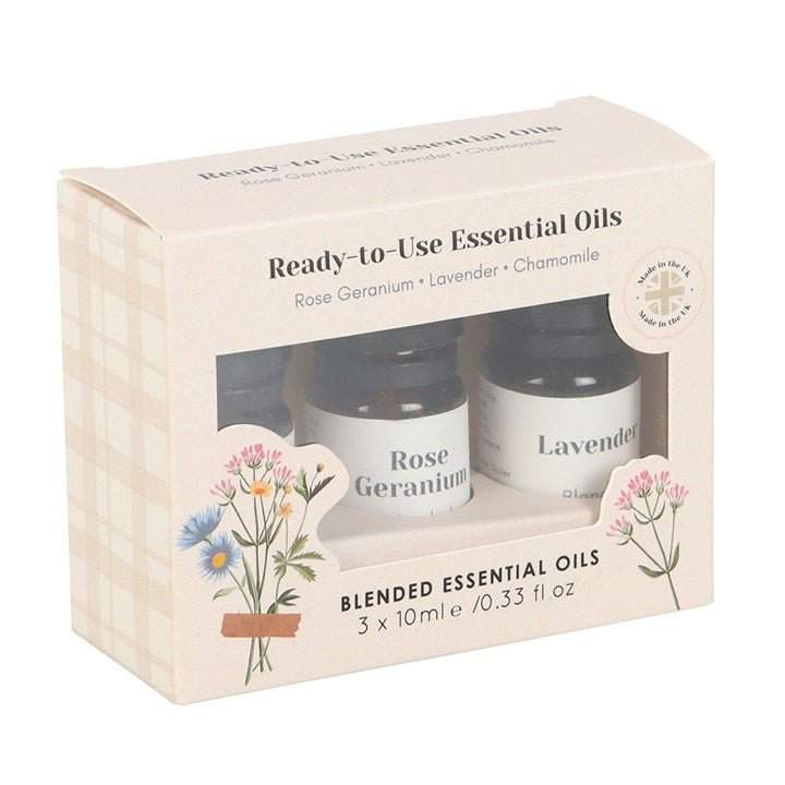 Set of 3 floral blended essential oils, featuring rose geranium, lavender, and chamomile, in 10ml bottles.