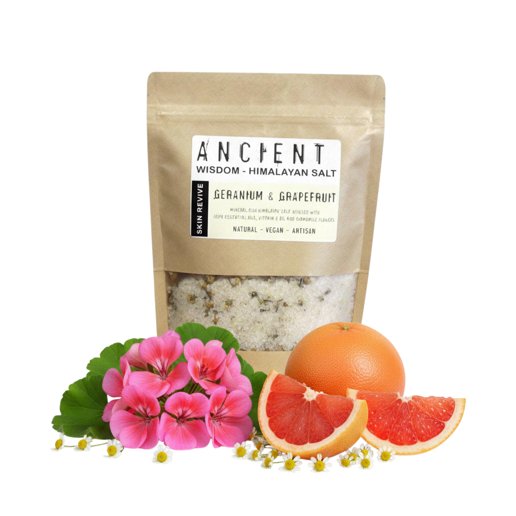 Skin Revive Himalayan Bath Salt in a kraft pouch with white salt, pink flowers, chamomile, grapefruit and whole orange