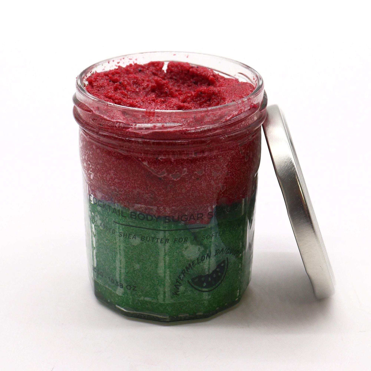 Sugar Body Scrub - Watermelon Daquiri in a clear jar with layered red and green exfoliating sugar crystals and a silver lid