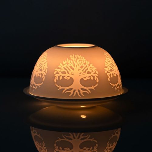 Tree of Life Dome Tealight Holder with intricate design illuminating in the dark.