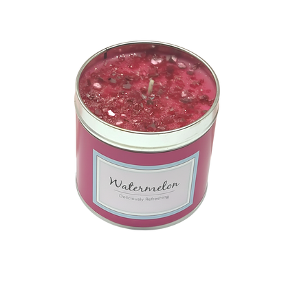 Watermelon Scented Candle in a pink container with glittery red wax topping and a centered wick, labeled Watermelon