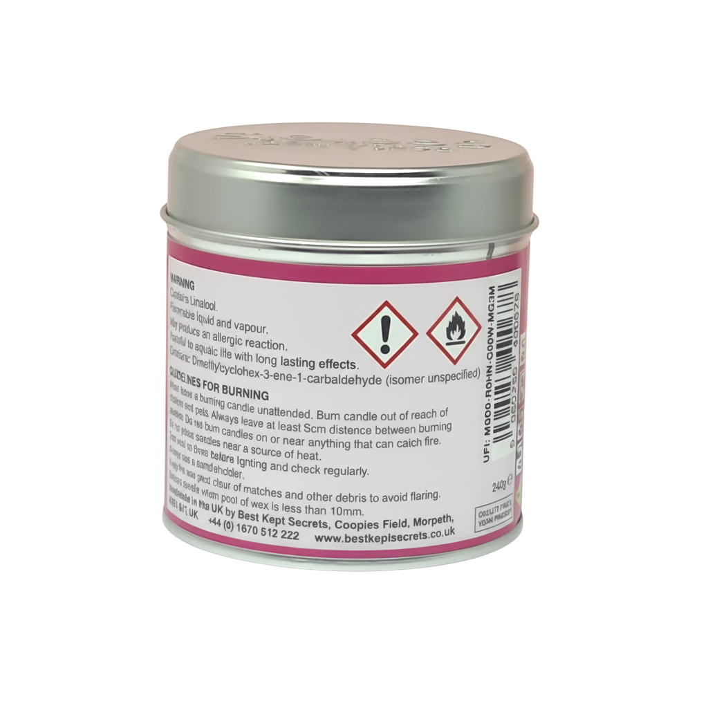 Watermelon Scented Candle in a small round pink metal tin with silver lid, featuring warning and usage labels