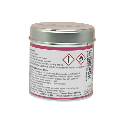 Watermelon Scented Candle in a small round pink metal tin with silver lid, featuring warning and usage labels